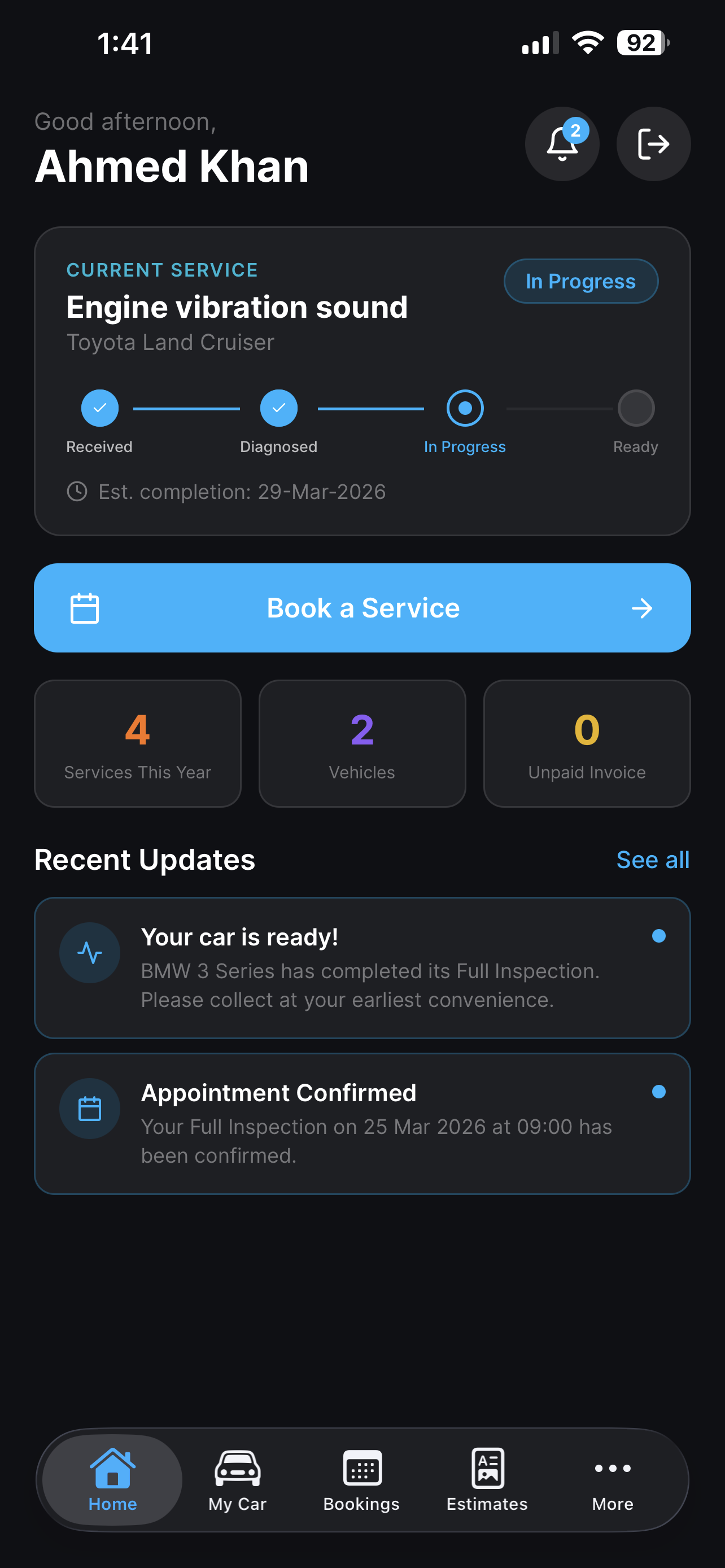 AutoSuite Customer Mobile App homescreen showing live job status, recent updates, and service booking